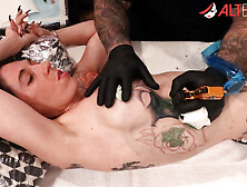 Marie Bossette gets a rose tattooed on her rib