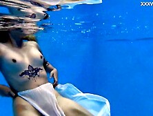 Finnish babe swims nude in the pool