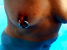 nippleringlover attractive mom swimming nude in pool see through pierced nipples humongous rings in pierced cunt lips