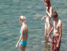 Hot nudists are posing on the beach