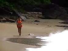 Dark Haired Milf Peeing At Beach