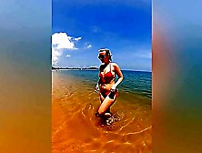 A sexy girl Lovita Fate playing on the beach in a bikini