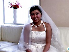 The recent Oriental bride remains attired in her bridal gown through a visitor's arrival