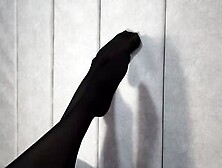 Stretching Beauty Legs And Foot Inside African Tights Lying On The Bed
