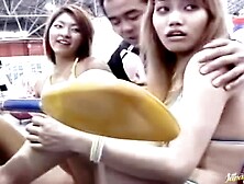 Two Asian Teen Chick In Mini Bikinis Flaunting Their Bodies In Arcades