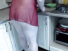 MILF Frina continues naked cooking.  Todays menu is chicken.  Sweet Milf in kitchen no panties in transparent negligee.  Natural bo