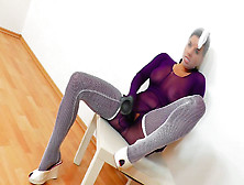 Brunette with big tits plays with black rubber dick