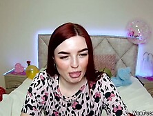 Big tits redhead strips to bra