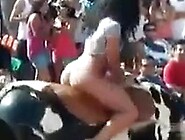 Chubby hoochie rides an electronic bull in her G-strings