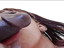 Green eyed ebony wraps her sweet lips around a big hard cock