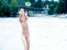 Nudist young enjoys a beautiful day at the beach