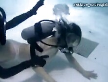 Female Scuba Divers Taking Action In The Water 1