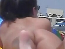 Naked hotties followed around by a nude beach voyeur