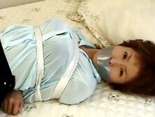 japanese girl tape gagged in skirt and blouse