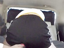 A married woman relaxes with an electric massage before a volleyball game that her family is coming to cheer her on.