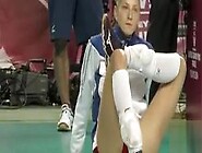 Leggy Volleyball Girl Stretches Before A Match