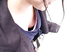 Asian sweetie lets a peek down her blouse