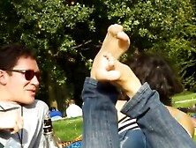 Candid soles brunette show in grass