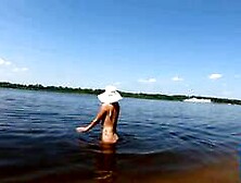 Blonde Solo Nudist Shows Off Tattoos by the River