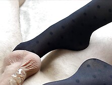 Great footjob in black nylon pantyhose