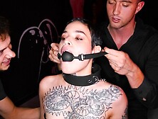 Obedient tattooed chick gets gagged and dominated by 2 rough studs in BDSM style