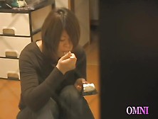 Asian doll licks the dildo and sticks it into the nub