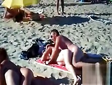 Swingers Having Fun Outdoors At A Beach