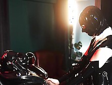 latex slave with rubber finest mask receives blowjob
