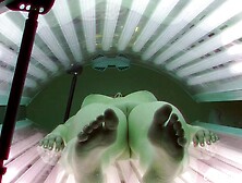 Busty Brunette In Solarium