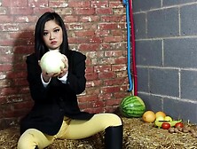 Equestrian Louisa crushing fruit wearing boots