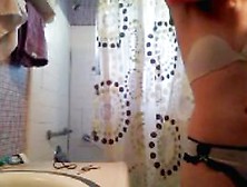Teenage brunette on the toilet and in the shower (18+)