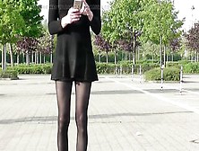 Crossdresser Outdoor In Ebony Costume,  Nylons And High Heels