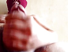 Bulky Oriental man in red mask stroking to spunk fountain