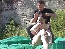 Outdoor bondage of American fetishist Caroline Pierce tied