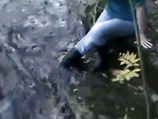 Wet jeans and blck boots