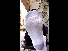 Attractive Latina strips off her socks and shows her super sexy feet outside