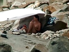 NUDIST COUPLES ON BEACH