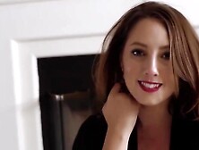 Great looking woman in erotic nylons and hot underware is posing in front of a fire place