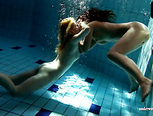 Zuzanna and Lucie kissing underwater
