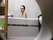 Peeping on her shower through a hole