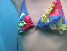 Tan lined chick uncovering her body in beach cabin