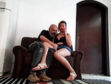 She converses with the cuck on the phone as her paramour plants kisses on her