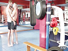 Muscled Men Working It Out At The Gym