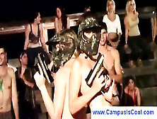 College students playing naked paintball
