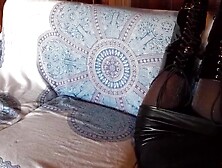 Total ebony with fishnets hose and boots over the knee