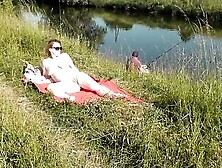 Naked Mature Woman Is Filmed While Sunbathing By The River