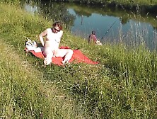 Nudist Beach. Public Nudity. Sexy Milf Without Panties And Bra Sunbathes Naked Is Not Shy About Fisherman. Naked In Public. Milf