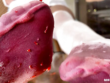 My Nylon Feet Squeezing Strawberry Juice on a Glass Table