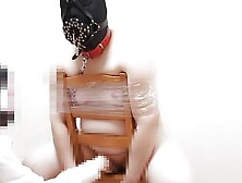 A slave is tied up in a chair and trained with a sex toy.