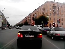 Topless babe riding in a BMW while in Russia